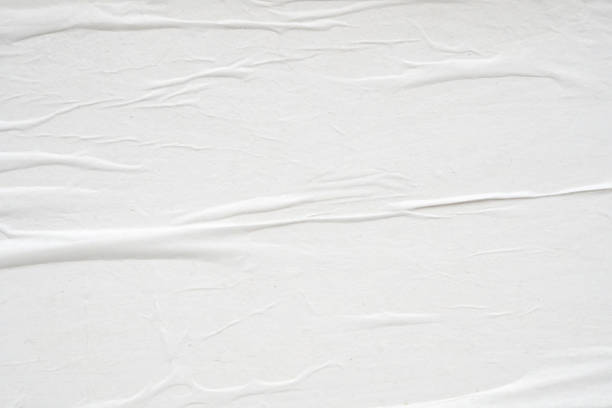 istock White blank crumpled and creased paper poster texture background 2008903402