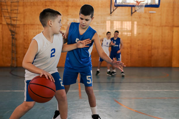 istock Basketball kids practicing game tactics and moves during game on training. 2008915558