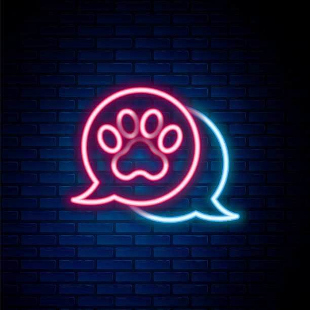 istock Glowing neon line Paw print icon isolated on brick wall background. Dog or cat paw print. Animal track. Colorful outline concept. Vector 2008961273