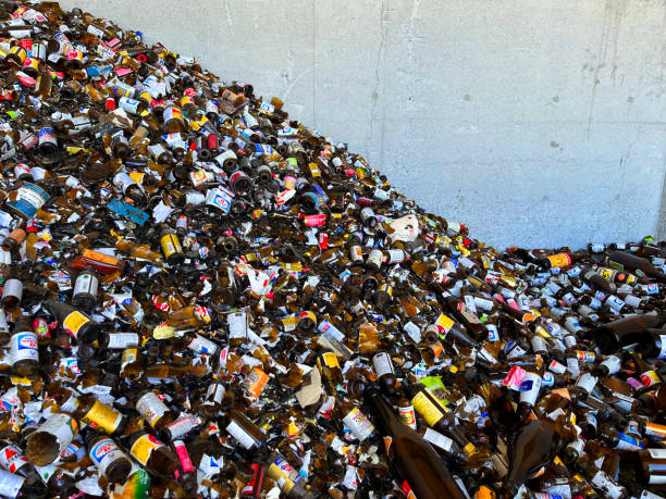 Colorful pile of broken glass bottles and containers ready for recycling