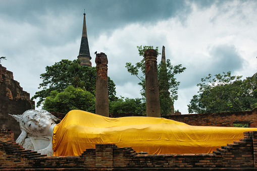 Reclining Buddha statue at Wat Yai Chai Mongkhon Buddhist temple in Ayutthaya, Thailand.