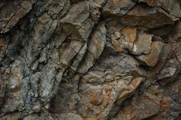 istock Stone rock mountain cave granite basalt mineral surface texture background. Dark gray brown beige. Crack broken crumbled crushed. Close-up. 3d. 2009015088