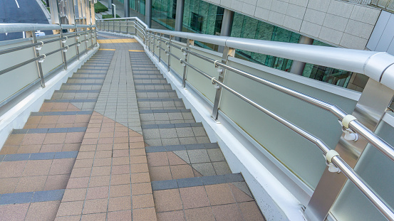 Staircase interior in lobby of hotel with glass window background