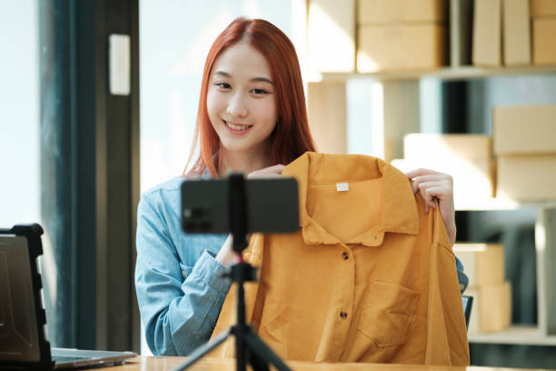 istock Entrepreneur Showcasing Clothes for Online Store 2009035974