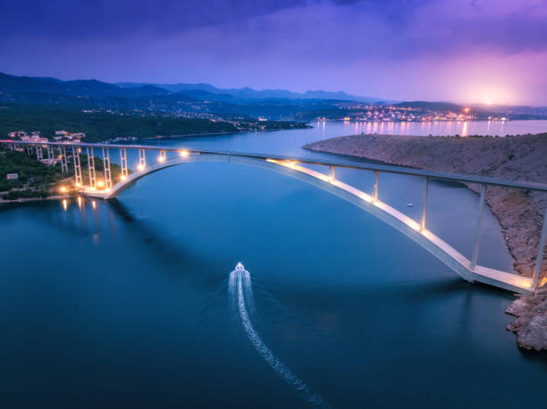 Free Stock Photo of Illuminated bridge at night over water | Download ...