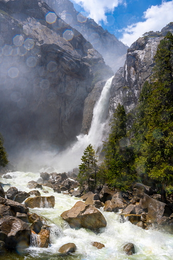Yosemite lower and upper fall with a powerful water flow, summer of 2023. Popular touristic place in USA.