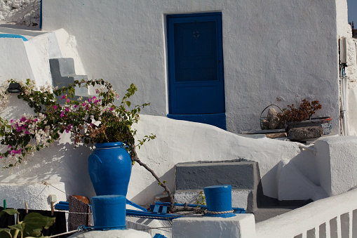 Santorini, Greece- September 20, 2017: Typical whitewashed facade with blue elements in Santorini, Greece.