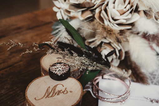 Neutral tones wood flowers with jewelry on wedding day