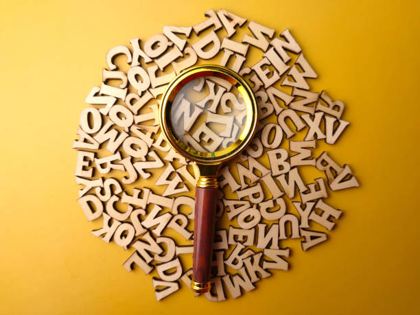 istock Vintage magnifying glass and wooden word 2009103379