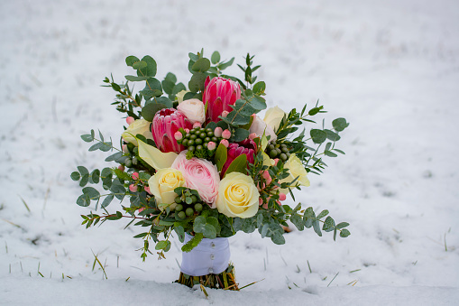 Winter wedding bouquet in the snow