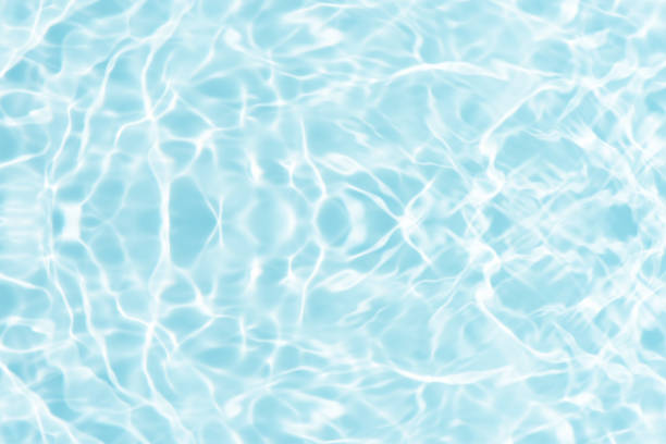 istock Water surface. Bluewater waves on the surface ripples blurred. Defocus blurred transparent blue colored clear calm water surface texture with splash and bubbles. Water waves with shining pattern. 2009138181