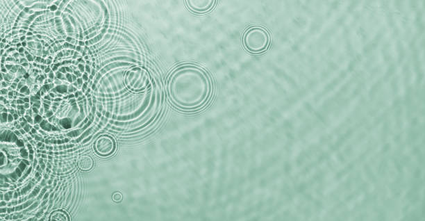 istock Water ripples on green background. Abstract water ripples texture. 2009187162