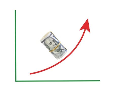 Stock graph formed by rolled up 100 american dollar bills with a red exponential growth up arrow,Finance concept