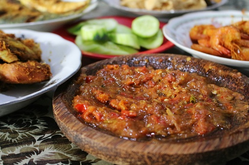 Chili Shrimp Paste from Indonesia with Cucumber and Fried Chicken in the background