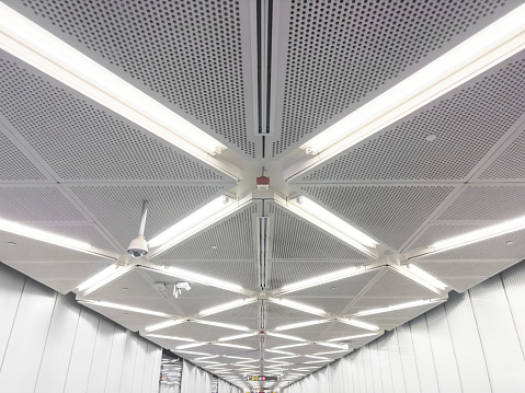 Ceiling lamps in a corridor of a subway tunnel