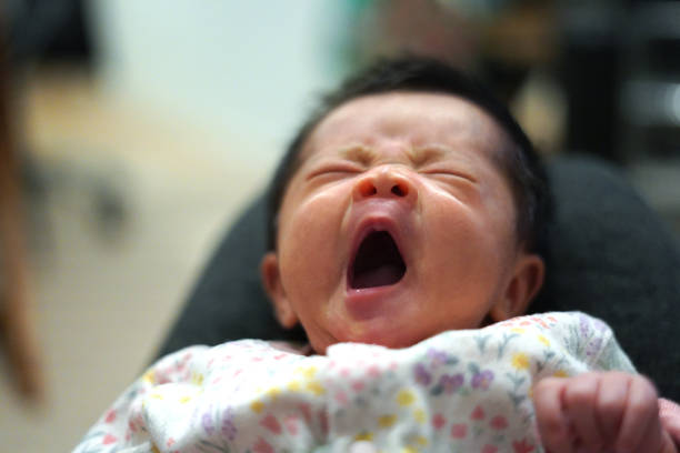 Mother taking care of a crying newborn baby