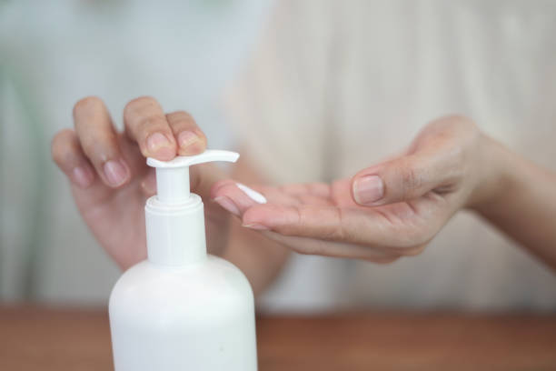 istock Hand pressing cream onto the hand 2009376460