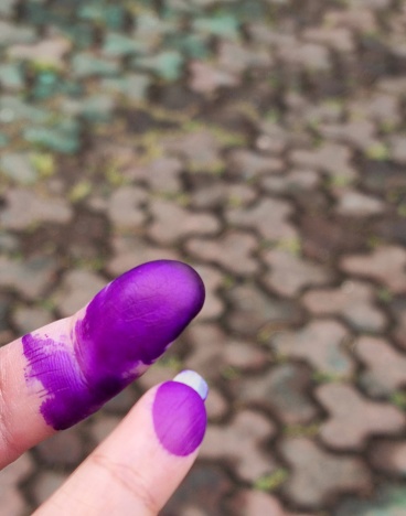 Bandung, Indonesia - Feb 14, 2024: Picture of inked fingers as the sign already elect the candidate in general election day