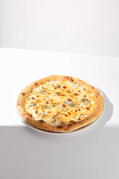 istock Italian Quattro Formaggi Pizza with Four Cheeses on White with Shadow 2009438995