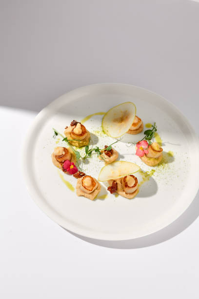 istock Top View of Seared Sea Scallops with Apple and Celery Puree, Shadow on White 2009438998