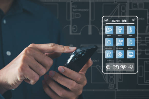 istock Man use smartphone to manage smart home features including security, lighting, and temperature. Smart home and Iot concept. 2009448529