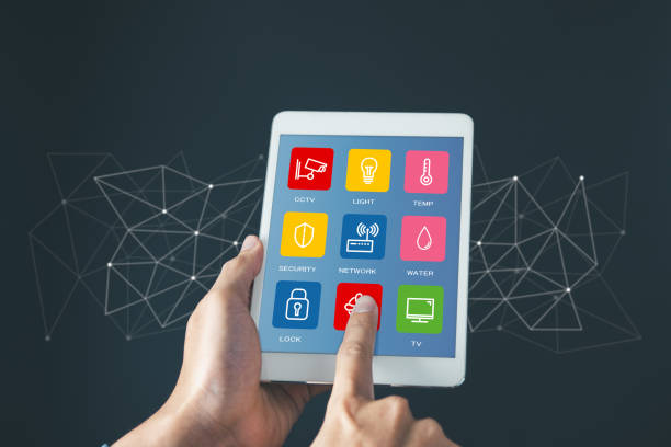 istock Man use tablet to manage smart home features including security, lighting, and temperature. Smart home and Iot concept. 2009452694