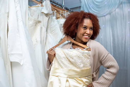 Shopping for used wedding dresses in a second-hand clothes store