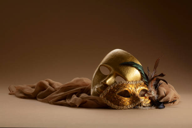 istock Golden Venetian carnival masks on a beige background. 2009516678