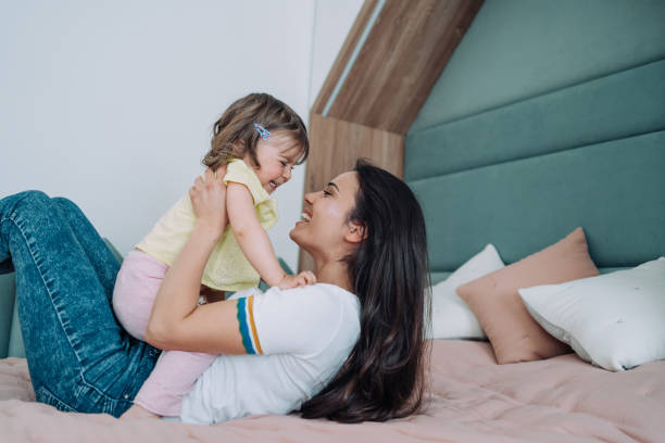 istock Affectionate mother and daughter embracing at home. 2009524024