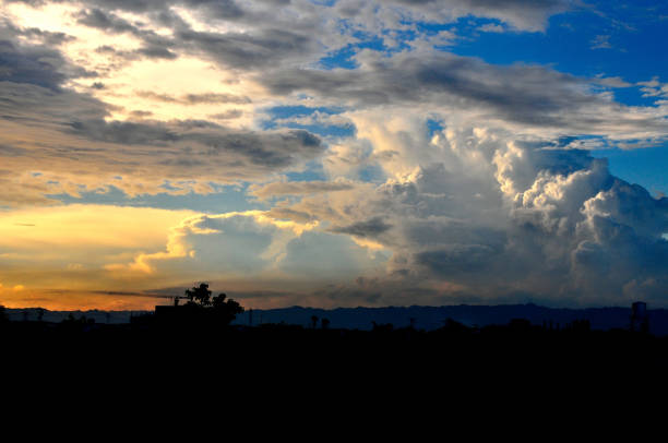 An image of heavenly formation of white clouds against the blue sky before sunset.
