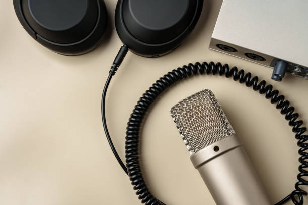 istock Headphones and microphone on the table close up 2009557434