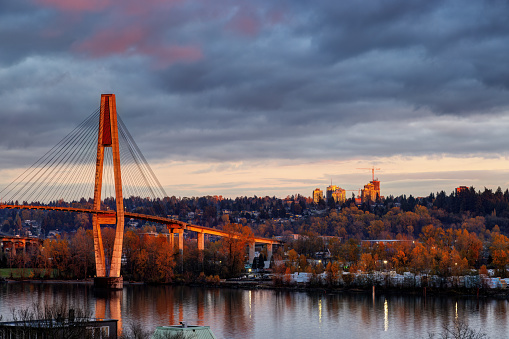 red sunset light colored the bridge and riversides, taken from New Westminster, BC, Canada