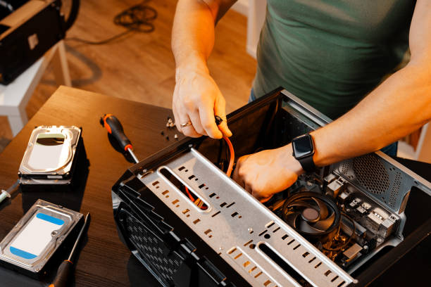 istock Close up of man repairing computer system unit 2009572002