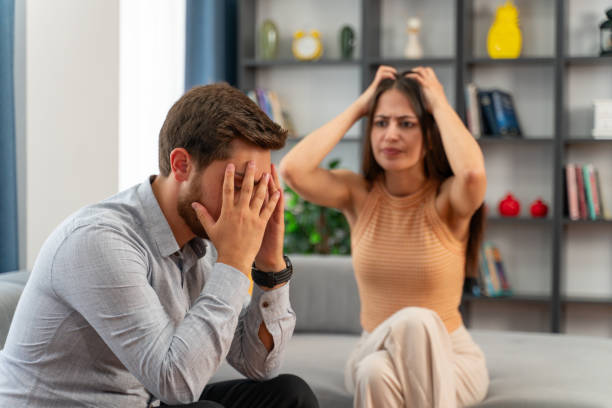 istock Young man frustrated by his girlfriend who constantly argues with him 2009579474