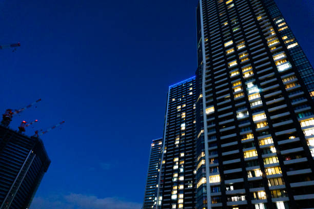 istock Night view of a high-rise condominium along an urban river 2009587376