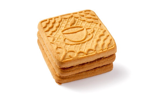 Stack of tea biscuits on white background. Sweet biscuits close-up.