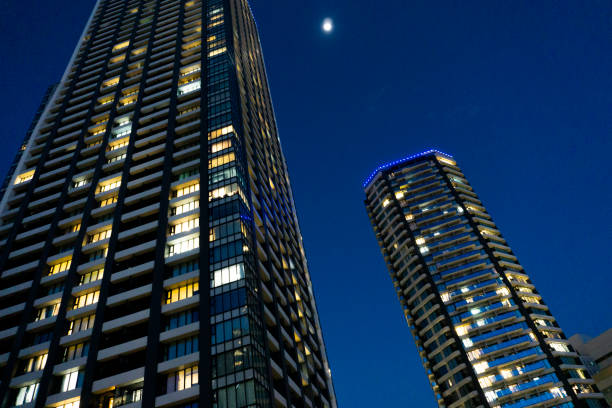 istock Night view of a high-rise condominium along an urban river 2009593302