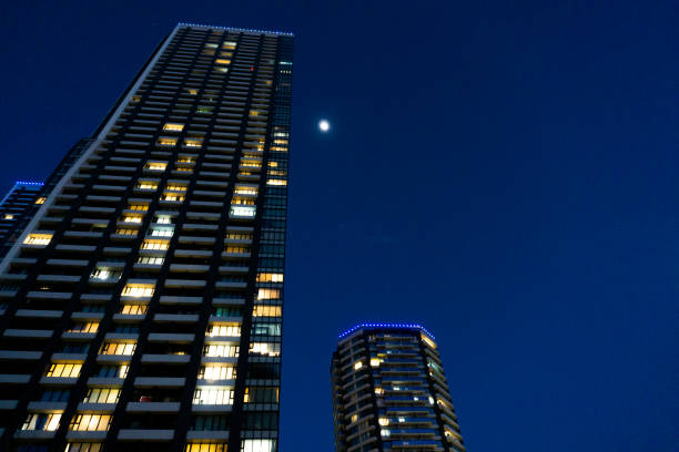 istock Night view of a high-rise condominium along an urban river 2009593807