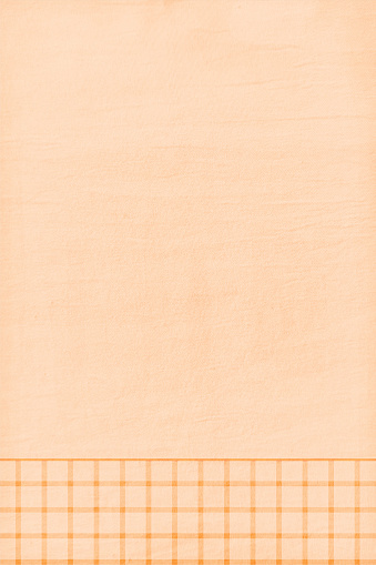 Empty blank very light brown or beige or khaki coloured grunge textured effect vertical vector backgrounds with a checkered border at bottom edge. Suitable to use as vintage paper, post cards, letters, manuscripts templates.