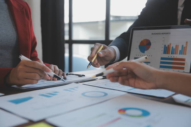 istock Finance manager meeting discussing company growth project success financial statistics, professional investor working start up project for strategy plan with document, laptop and digital tablet. 2009624268