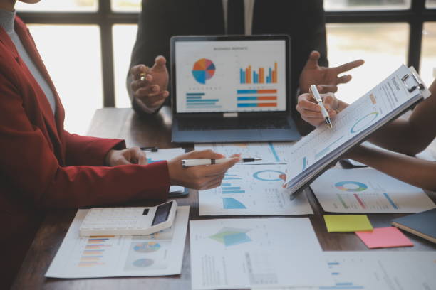istock Finance manager meeting discussing company growth project success financial statistics, professional investor working start up project for strategy plan with document, laptop and digital tablet. 2009624281