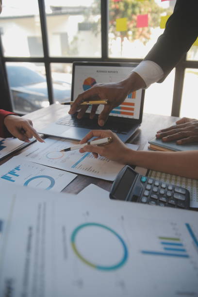 istock Finance manager meeting discussing company growth project success financial statistics, professional investor working start up project for strategy plan with document, laptop and digital tablet. 2009626976