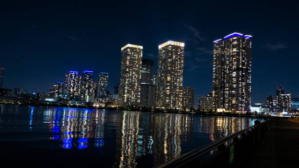 istock Night view of a high-rise condominium along an urban river 2009642668