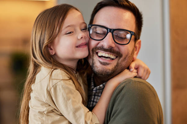 istock Happy single father and daughter embracing at home. 2009659039