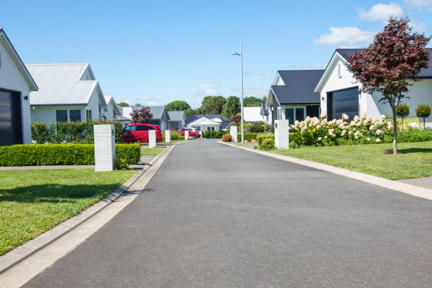 istock Suburban homes lining new orderly street. 2009663791