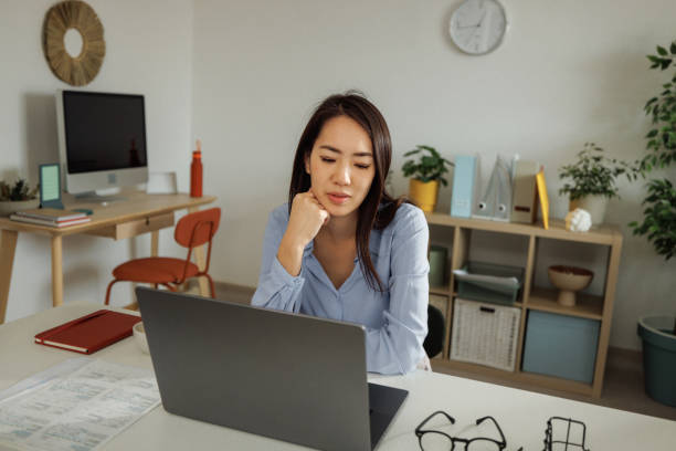 istock Exhausted woman working at home office 2009664850