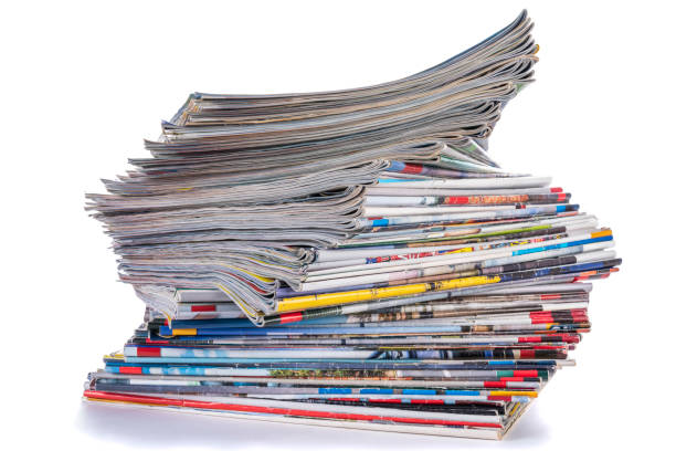 istock Pile of old paper magazines isolated on white 2009665901