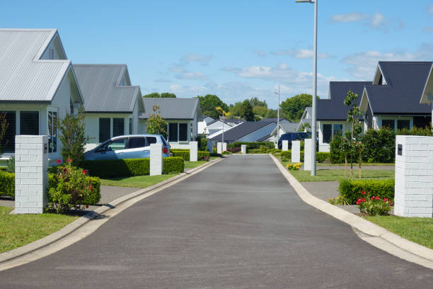 istock Suburban homes lining new orderly street. 2009666952