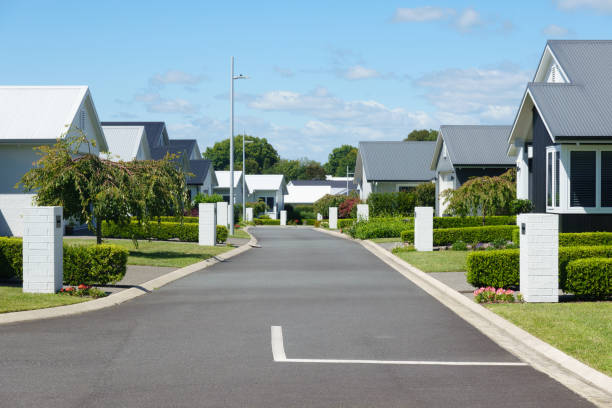 istock Suburban homes lining new orderly street. 2009667477