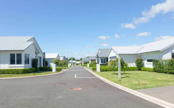 istock Suburban homes lining new orderly street. 2009668080
